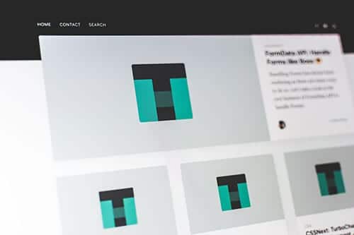 A computer screen displaying a website with a black navigation bar, a grid of teal and black block logos, and a news post preview on the right side—perfect inspiration for small business website packages. - Clio Websites | Top Canadian Web Design Company