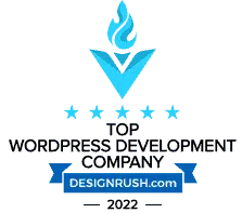 Blue badge with a white arrow pointing downwards and text reading "Top WordPress Development Company" above "DesignRush.com," symbolizing the pinnacle of Clio websites expertise. - Clio Websites | Top Canadian Web Design Company